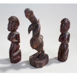 Three African tribal figures, to include a pair of fertility figures and a carved example of a