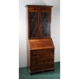 George III style mahogany bureau bookcase, the astragal glazed cabinet above a sloping fall and a