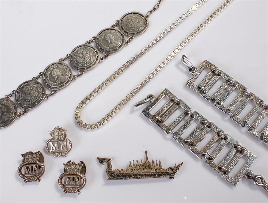 Mixed white metal objects.