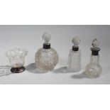 Silver and cut glass bottles, each glass piece with a silver collar or base, (4)