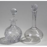 Two glass decanters, one with cut glass the other etched, (2)