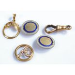 18 carat gold watch chain clip, together with two 15 carat gold discs, and two yellow metal