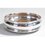 Elizabeth II silver coaster, London 1969, the silver ring with turned beech base, 11cm wide