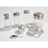 Collection of silver objects, various dates and makers, to include four silver capped glass bottles,