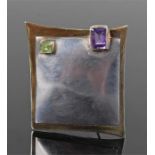 Silver amethyst and peridot brooch, the shaped rectangular brooch with a rectangular amethyst and