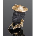 9 carat gold and carved ebonised pendant, of a lady with a hat and collared shirt, 29mm high