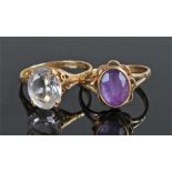 Two 9 carat gold rings, to include an amethyst example and clear stone example, (2)