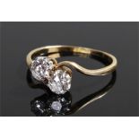 18 carat gold diamond set ring, with two diamonds to the head with swirl shoulders, ring size P