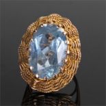 Gold ring, with a pale blue stone with facetted edges, ring size K