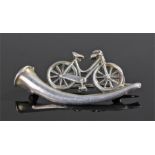 Suffragette interest, a silver brooch assayed for Chester 1896 depicting a bicycle above a horn,