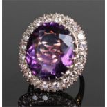 Impressive 18 carat gold amethyst and diamond ring, the central amethyst at approximately 21