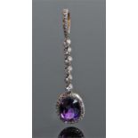 Diamond and amethyst pendant, the pendant with a drop diamond set beam above the amethyst and