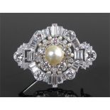 Natural pearl and diamond set brooch, the central pearl at 18.61 grams with a round cut and baguette