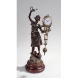 French 1920's spelter mystery clock, the stand in the form of a lady in charmeuse with a swing