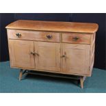 20th Century oak sideboard, the shaped rectangular top above two frieze drawers above three cupboard