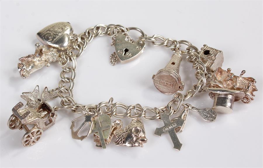 Silver charm bracelet, with various charms