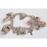 Silver charm bracelet, with various charms