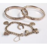 Silver jewellery, to include two bracelets and a charm bracelet