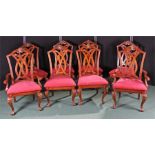 Set of eight mahogany dining chairs, each with a carved and fret back above drop in seats and