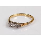 18 carat gold and diamond ring, set with three diamonds, 1.9 grams