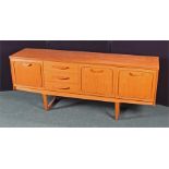 Mid 20th Century teak side board, with rectangular top above cupboard drawers and angled legs