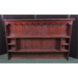 17th Century style dresser rack, with a shaped top above shelved back