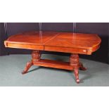 Mahogany extending dining table, the pull our top with three additional leaves above the large