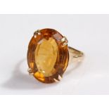 9 carat gold ring, set with an orange stone, ring size J