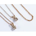 9 carat gold chains, three in total, together with two stone set pendants, total weight 4.8 grams