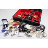 Jewellery box containing assorted costume jewellery, including cuff links, necklaces, and