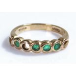 9 carat gold emerald ring, with four emeralds to the head, one stone missing, ring size M