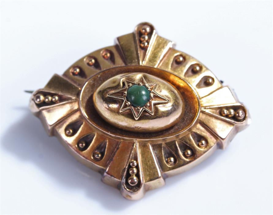 Victorian yellow metal mourning brooch, with central green stone, glazed case back, 37mm wide