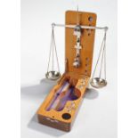 Finely engineered set of scales, the fitted case with beam, deep pans and fitted weights, smaller