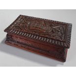 Suffolk Regiment, a carved cigar box, with the Suffolk crest and acorn branch surround, 28cm wide