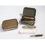 World War II emergency rations tin, with contents, together with FN Rifle cleaning kit, (2)