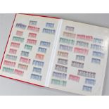 Stamp album. British stock book of duplicated mint and used stamps including GV1 Coronation