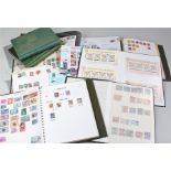 Six stamp albums, including two Commonwealth albums, a royal album, a New Zealand album, a