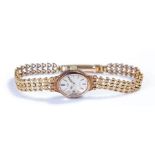 Rotary 9 carat gold ladies wristwatch, the signed silver dial with 9 carat gold strap