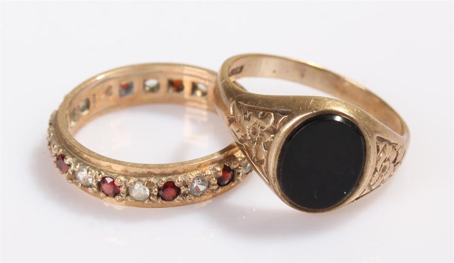 Two 9 carat gold rings, the first a signet ring set with onyx, the second an eternity ring, total