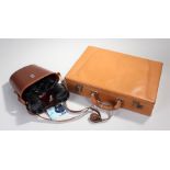 Tan leather briefcase and a pair of Wray binoculars