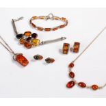 Amber jewellery, to include two bracelets, a necklace, a pendant necklace and two pairs of earrings,