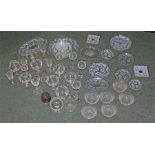 Large quantity of cut and etched glass, including plates, bowls, tumblers, and wine glasses (qty)