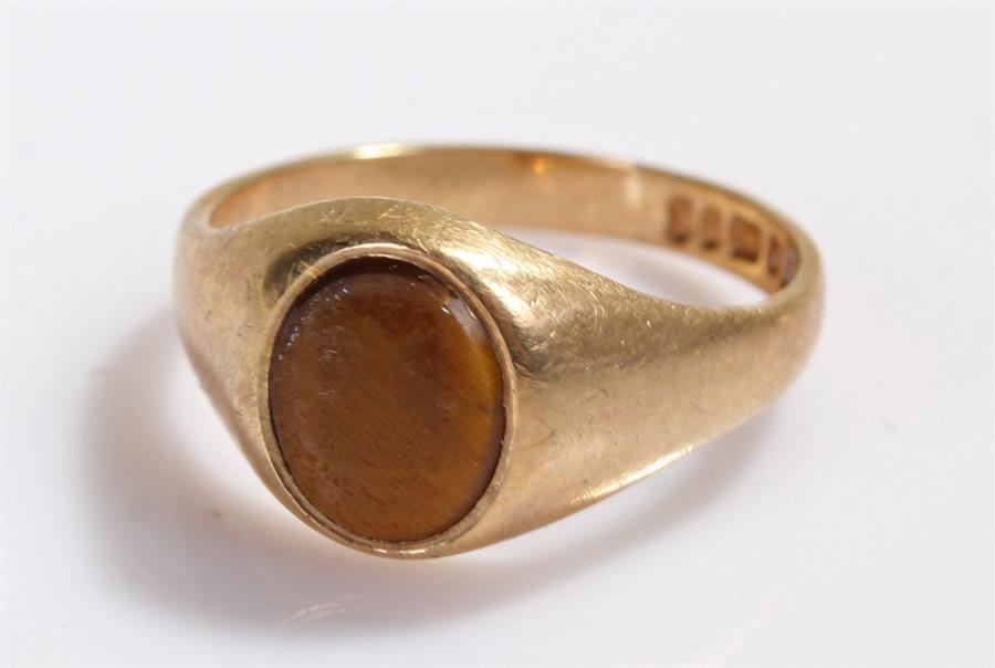 9 carat gold tigers eye signet ring, set with an oval tigers eye