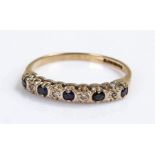 9 carat gold sapphire ring, with a row of sapphires and diamonds