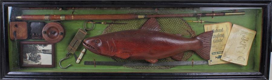 Angling-themed display case, containing a Trout, lines, a photograph, other tools, and guides (H: