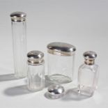 George V silver capped bottles, London 1919, with four glass bottles with silver caps, a single