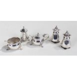 George V silver cruet set, London 1915, with lion mask and paw feet, together with a pair of