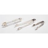 Silver sugar tongs, to include a fret pair of small proportions and two shell bowl examples, 1.