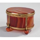 Victorian oval agate box, the oval hinged lid with gilt brass fittings above arched panels to the