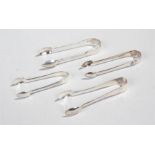 Silver sugar tongs, to include a swirl shell example, fiddle pattern, and two others, 2.9oz, (4)